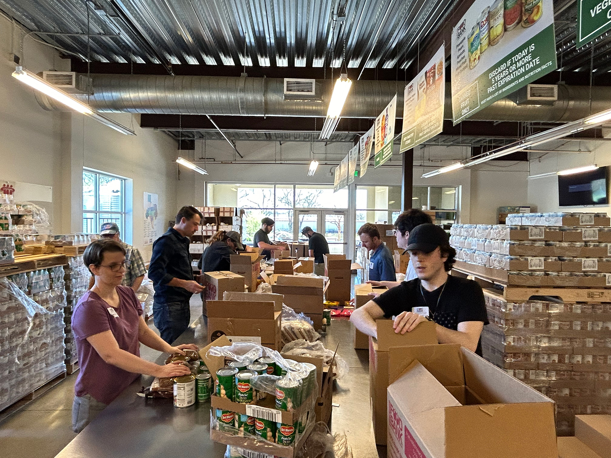 Veramendi volunteers packing bread bags for donations