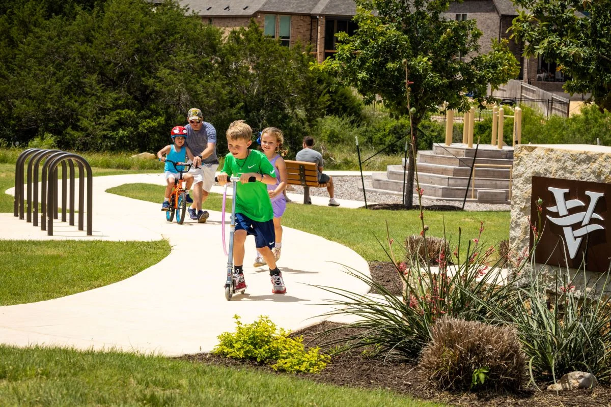 Veramendi residents are skating and riding bicycles.