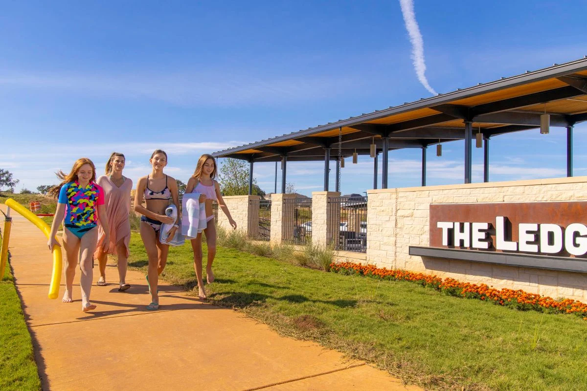 A group of Veramendi residents taking a walk by The Ledge, Veramendi's first amenity center. 