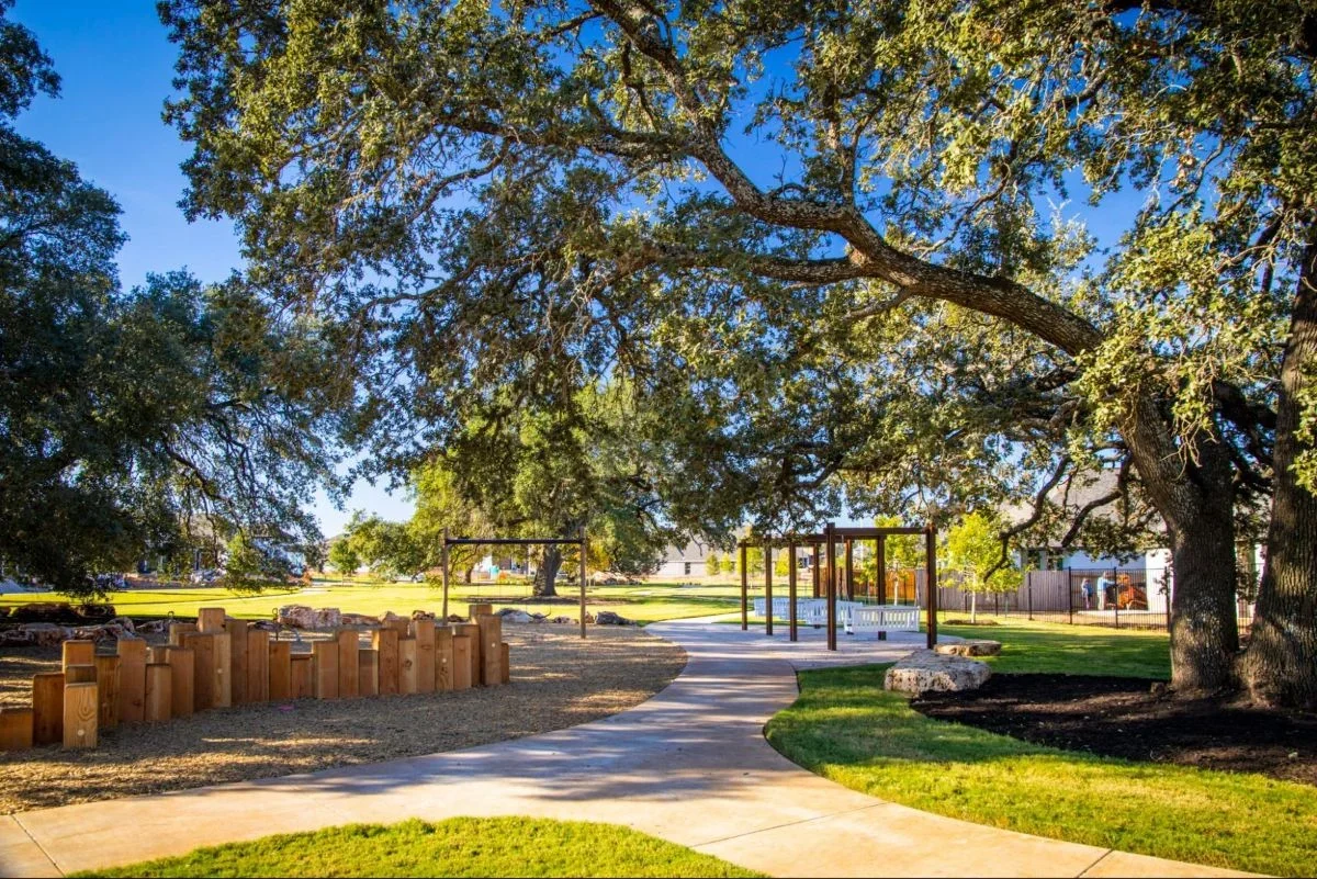 Veramendi trails with large Oak trees surrounding the trail.